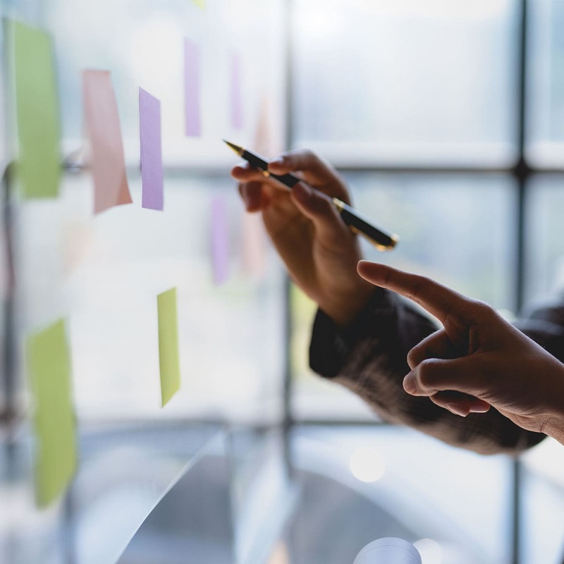 Professionals using sticky notes