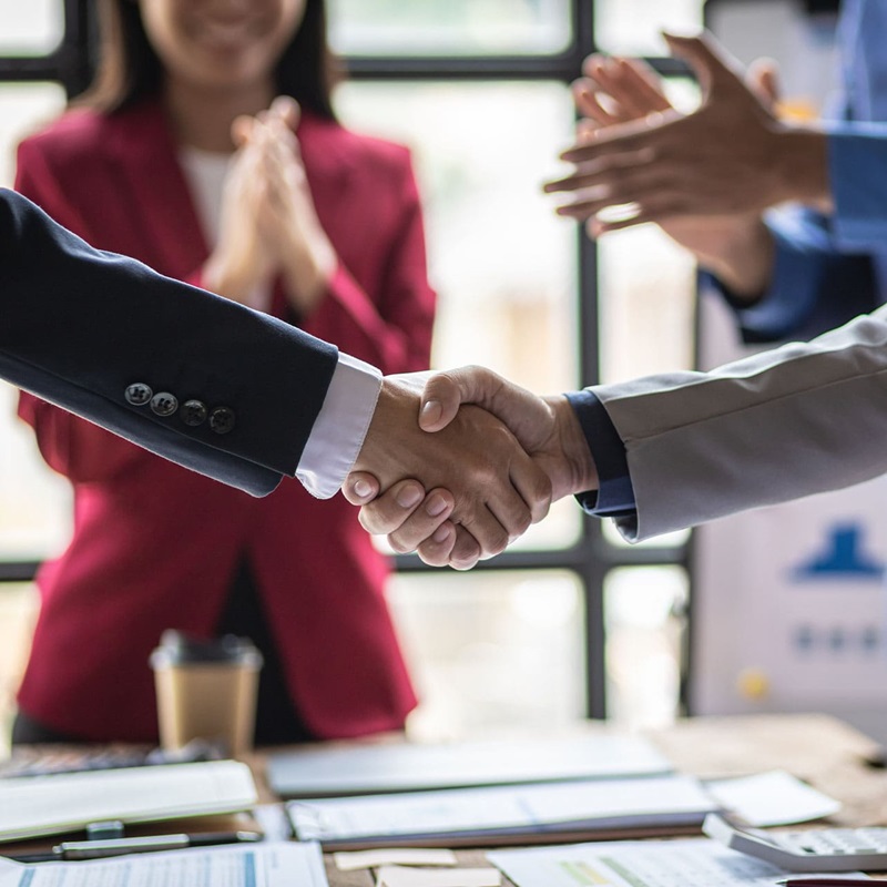 Business professionals shaking hands