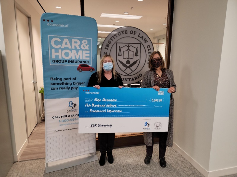 Giveaway Winner Holding Cheque