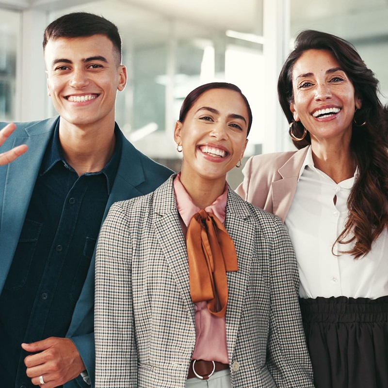 Three young law clerks smiling
