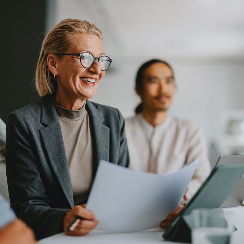 Law clerk smiling while in a business meeting