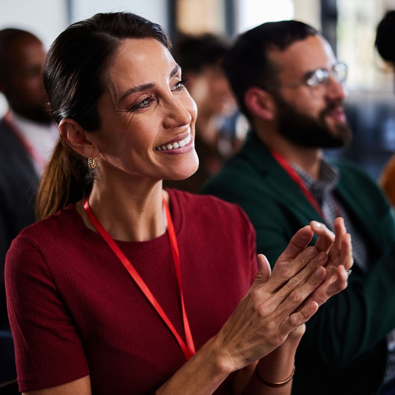 Law clerk smiling while watching a presentation